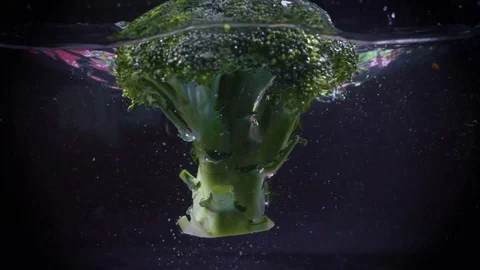 The broccoli falls into the water. Stock Footage 122982161