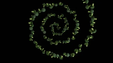 Broccoli flying in helix shape, upper view, seamless loop, against black Stock Footage 171110581