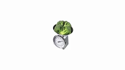 Broccoli on kitchen scales Stock Footage 8574467