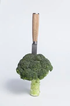 Broccoli with knife Stock Photos