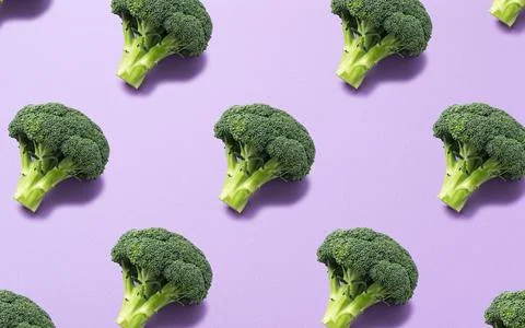 Broccoli lined up regularly on a purple background Stock Photos