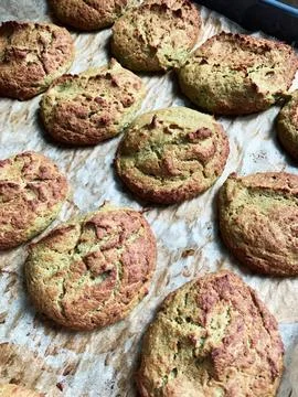Broccoli pancakes sit on a baking sheet lined with parchment paper. They ar.. Stock Photos