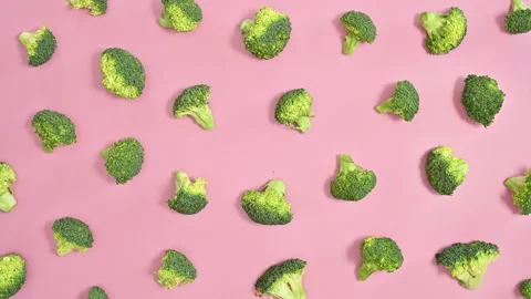 Broccoli pattern on pastel pink background. Stop motion flat lay Stock Footage 201696805