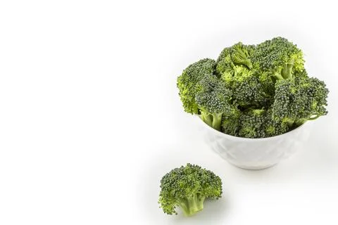 Broccoli pieces isolated on white background. Stock Photos
