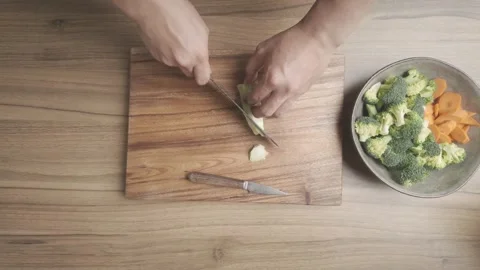 Broccoli Preparation Cutting Chopping and Slicing on Kitchen Countertop Stock-Footage 329814682