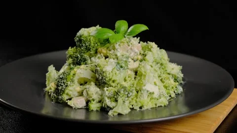 Broccoli Salad with Basil on Black Plate Cooking Stock Footage 341442985