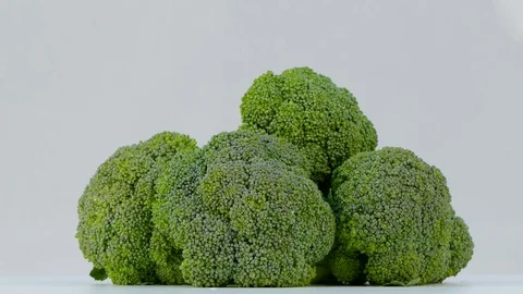 Broccoli spinning on a white background Stock Footage 84591682