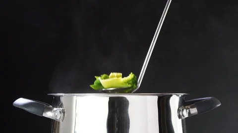 Broccoli on a spoon. Broccoli soup. Broccoli is cooked in a saucepan. Vegetables 動画素材 89841277