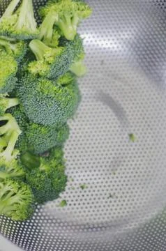 Broccoli in a steamer closeup Stock Photos