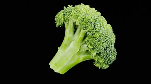 Broccoli top view on black background, fresh green broccoli close-up, vitamins Stock Footage 170141786