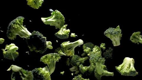 Broccoli turning on a black background. Slow motion Stock Footage 105345933