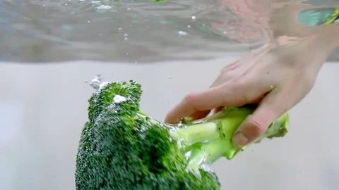 Broccoli in water in slow motion Stock Footage 76041188