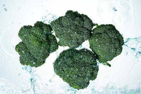 Broccoli water splash Stock Photos