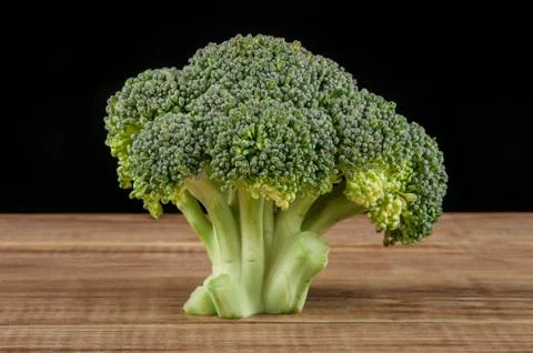Broccoli on a wooden table Stock Photos
