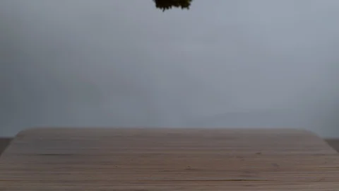 Broccolis falling on chopping board in slow motion Stock Footage 100006991