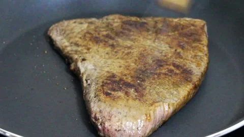 Broiling, searing a delicious steak Stock Footage 281575311