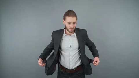 Broke businessman with empty pockets Stock Footage 154502068