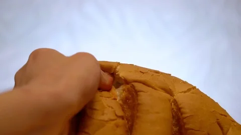 Broke off a piece from a loaf 库存影片 76437194