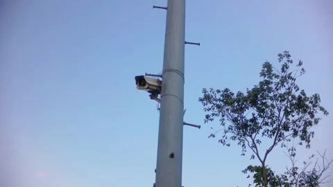 Broken and abandoned surveillance camera on a pole, concept of security system f Stock Footage 340579721