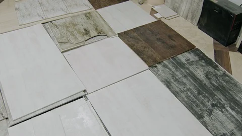 Broken and bad painted ceramic tiles are lying on floor in warehouse, panoramic Video stock 104836419
