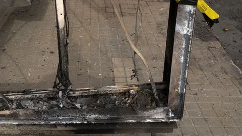 Broken and burnt bus stop, close up Stock Footage 118258215