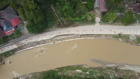Broken and damaged road after huge flood in Malaysia Stock Footage 168575312
