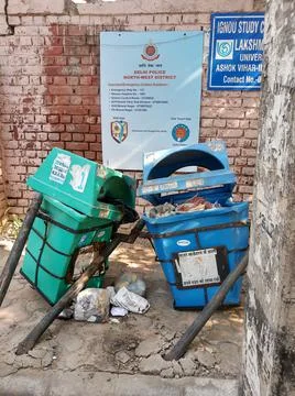 Broken and damaged trash bin made of plastic box Stock Photos