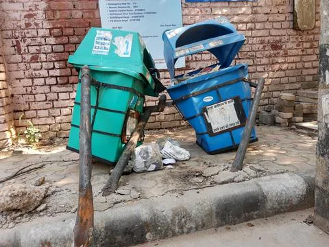 Broken and damaged trash bin made of plastic box Stock Photos