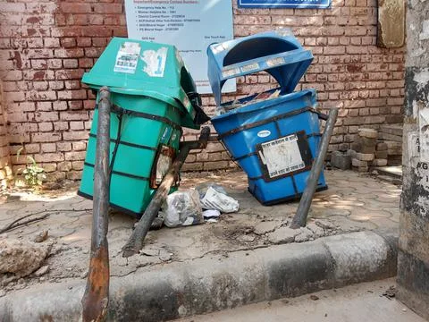 Broken and damaged trash bin made of plastic box Stock Photos