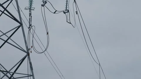 A broken and fallen high-voltage tower against the backdrop of a sunset sky. Stock-Footage 241358171
