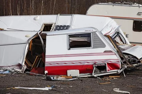 Broken and mashed caravan that is abandoned Stock Photos