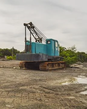 A broken and rusty mobile crane from behind. Stock Photos
