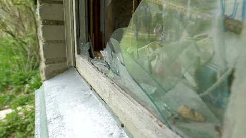 Broken and shattered glasses of the window Stock Footage 137359119