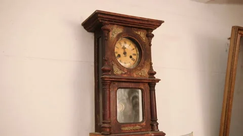 Broken antique mechanical wall clock that once showed the hour in room. Time Stock Footage 152599629
