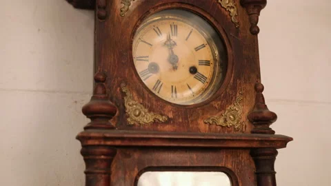 Broken antique mechanical wall clock that once showed the hour in room. Time Stock Footage 152599812