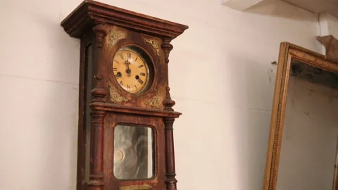 Broken antique mechanical wall clock that once showed the hour in room. Time Stock Footage 153700039