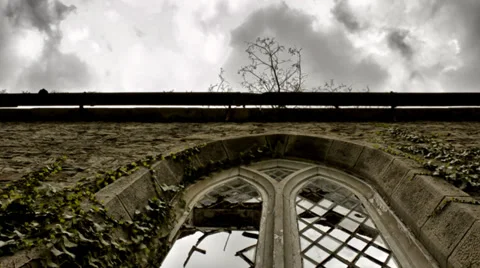 Broken arch church window with clouds timelapse pan Stock Footage 33891989