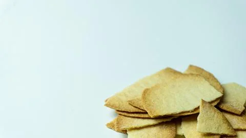 Broken baked chips crisps isolated on white background Stock Photos