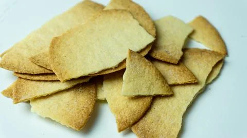Broken baked chips crisps isolated on white background Stock Photos