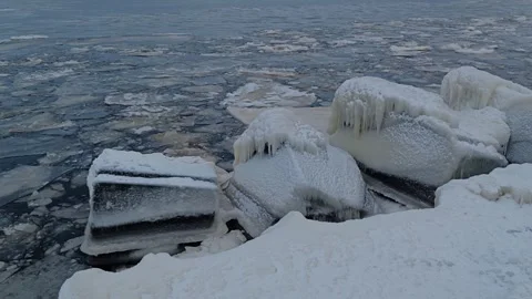 Broken Baltic Sea Ice Washes Toward Daugavgriva Shore, Frozen Riga Coastline Stock Footage 346266500