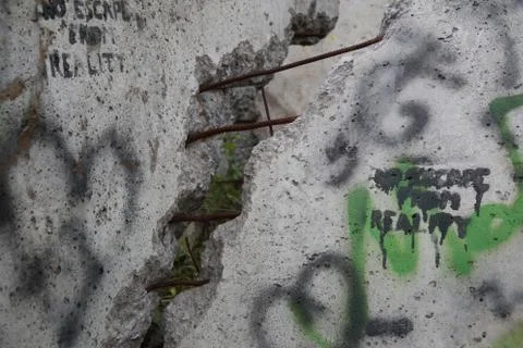 Broken Berlin Wall with Graffiti Stock Photos