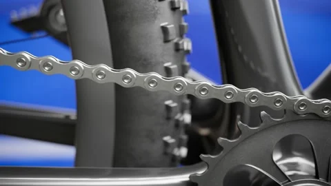 Broken bicycle chain. Close up on one broken link on a chainring. Slow motion. Stock Footage 202276461