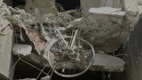 A broken bicycle lies in a destroyed building after being bombed by russian Video stock 201293384