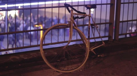 Broken bike on bridge at Berlin train station, night time Stock Footage 67986345