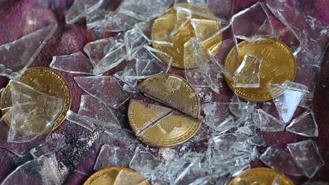 Broken bitcoin. The collapse of the cryptocurrency Stock Footage 90211420