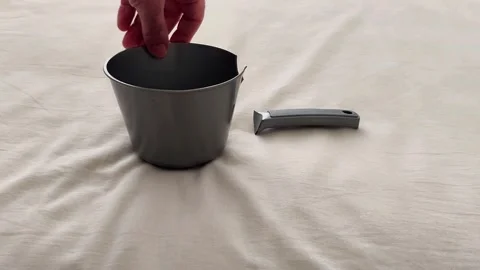 Broken Black Plastic Container with Detached Handle on Fabric Surface 스톡 동영상 325788890