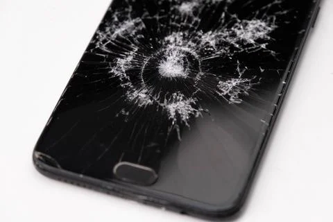 Broken black touch screen phone isolated on a white background.  Stock Photos