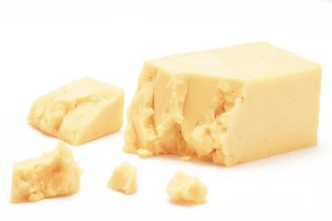 Broken Block of White Cheddar Cheese assorted chunks pieces bits Stock Photos