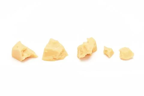 Broken Block of White Cheddar Cheese assorted chunks pieces bits Stock Photos