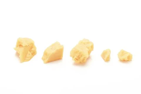 Broken Block of White Cheddar Cheese assorted chunks pieces bits Stock Photos